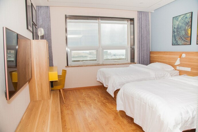 Imagen de la habitación del Hotel Hansand Casa Ai Service Apartment. Foto 19