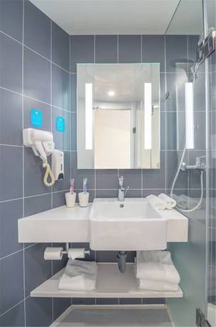 Imagen de la habitación del Hotel Hanting Express Shanghai Guilin Road. Foto 2