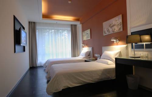 Imagen de la habitación del Hotel Hanting Express Tianjin Tonglou. Foto 1