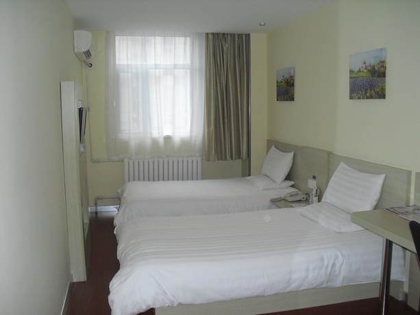Imagen de la habitación del Hotel Hanting Qingdao May Fourth Square. Foto 6