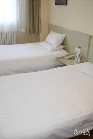Imagen de los interiores del Hotel Hanting Qingdao May Fourth Square. Foto 17