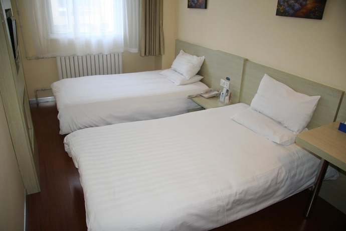 Imagen de la habitación del Hotel Hanting Qingdao May Fourth Square. Foto 15