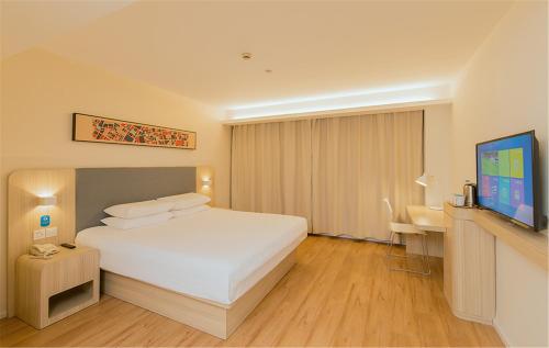 Imagen de la habitación del Hotel Hanting Shanghai Jinshan Square. Foto 8