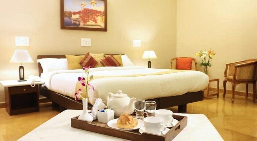 Imagen de la habitación del Hotel Hanu Reddy Residences Poes Garden. Foto 18