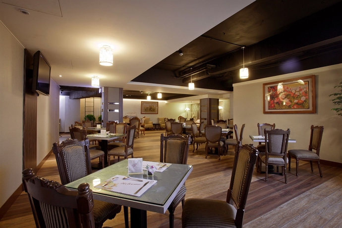 Imagen del bar/restaurante del Hotel Happiness. Foto 3