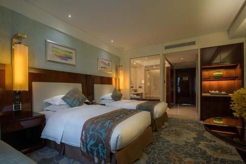 Imagen de la habitación del Hotel Happiness Hotel, Changzhou. Foto 10