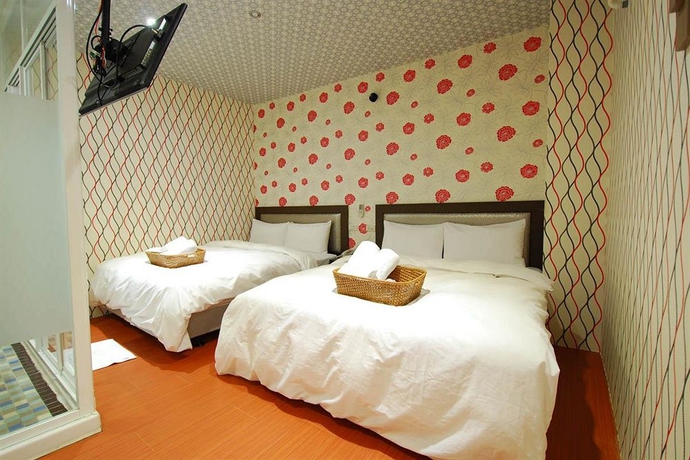 Imagen de la habitación del Hotel Happiness Inn. Foto 5