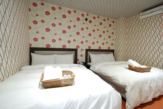 Imagen de la habitación del Hotel Happiness Inn. Foto 8