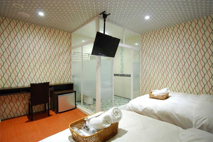 Imagen de la habitación del Hotel Happiness Inn. Foto 9