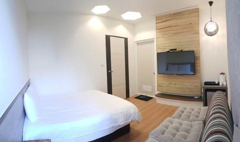 Imagen de la habitación del Hotel Happiness Yes Inn. Foto 6