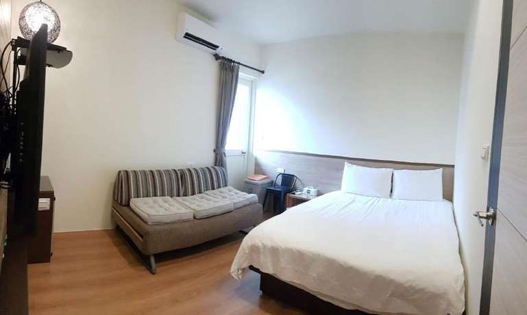 Imagen de la habitación del Hotel Happiness Yes Inn. Foto 9