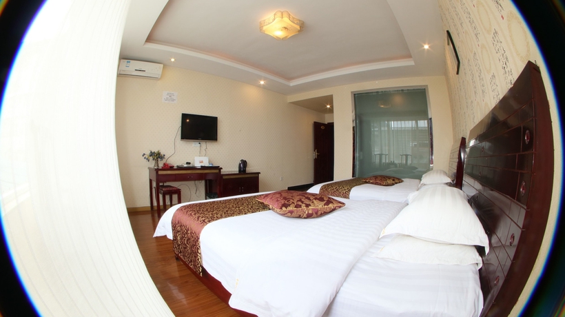 Imagen de la habitación del Hotel Happy, Emei shan. Foto 13