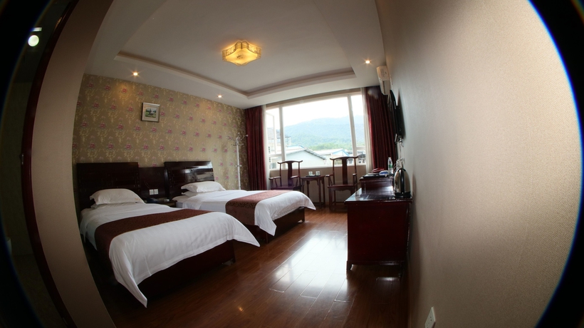 Imagen de la habitación del Hotel Happy, Emei shan. Foto 14