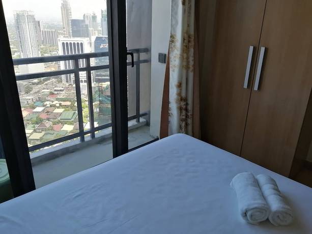 Imagen de la habitación del Hotel Happy Suites At Knightsbridge Res Makati. Foto 10