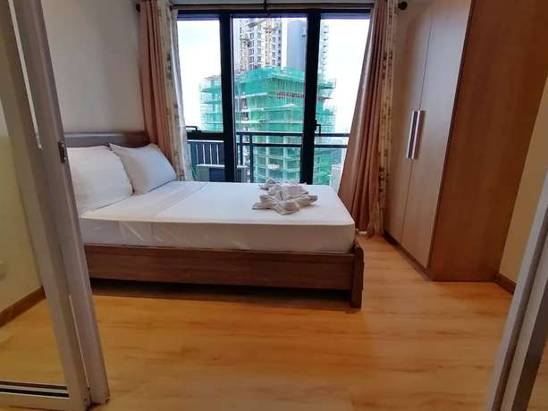 Imagen de la habitación del Hotel Happy Suites At Knightsbridge Res Makati. Foto 11
