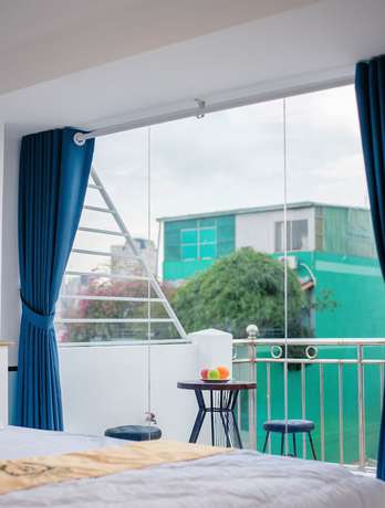 Imagen de la habitación del Hotel Happyhomes Saigon Central. Foto 11