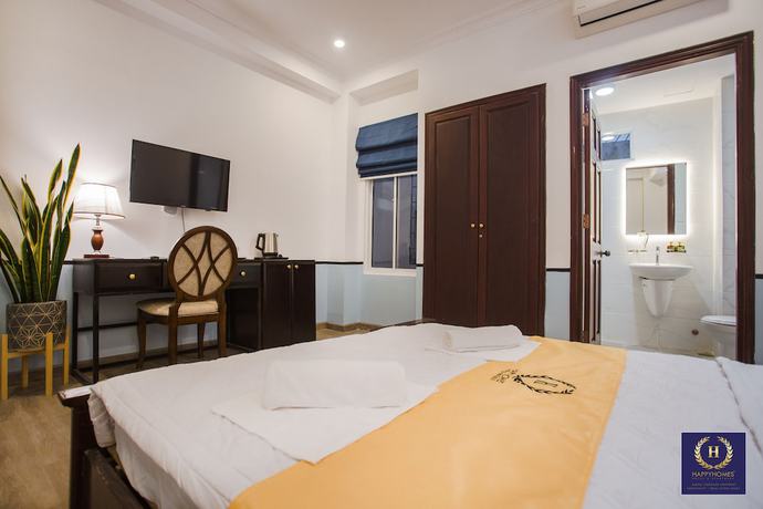 Imagen de la habitación del Hotel Happyhomes Saigon Central. Foto 14