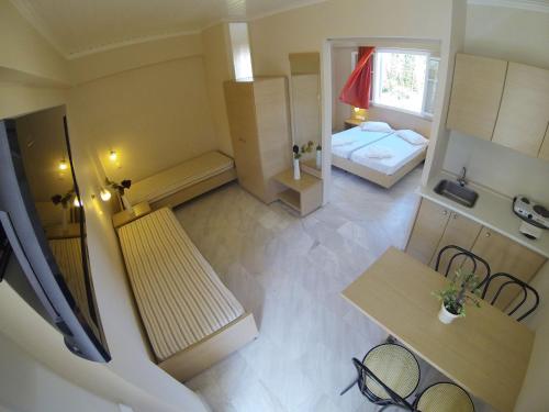 Imagen de la habitación del Hotel Happyland Apartments. Foto 5
