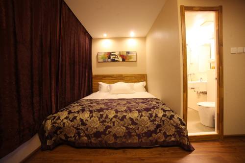 Imagen de la habitación del Hotel Harbin Beibei Holiday Central Street. Foto 1