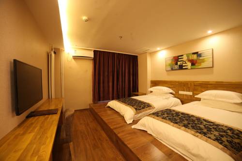 Imagen de la habitación del Hotel Harbin Beibei Holiday Central Street. Foto 2