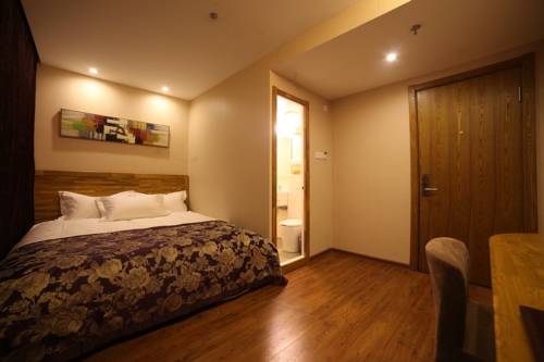 Imagen de la habitación del Hotel Harbin Beibei Holiday Central Street. Foto 5