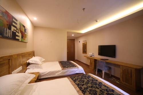 Imagen de la habitación del Hotel Harbin Beibei Holiday Central Street. Foto 6