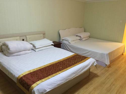 Imagen de la habitación del Hotel Harbin Haxi Mingren Apartment. Foto 1