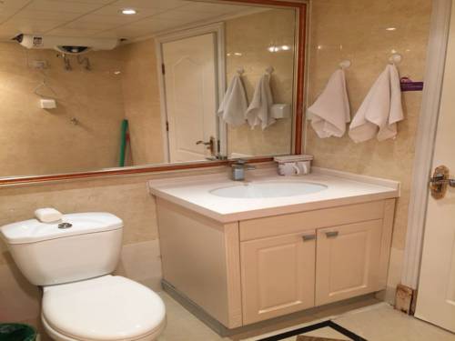 Imagen de la habitación del Hotel Harbin Haxi Mingren Apartment. Foto 6