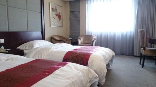 Imagen de la habitación del Hotel Harbin Jingu Hotel. Foto 8