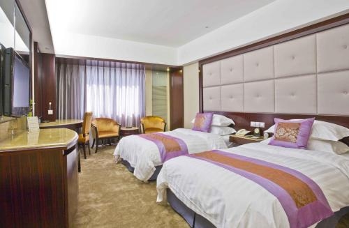 Imagen de la habitación del Hotel Harbin Jingu Hotel. Foto 9