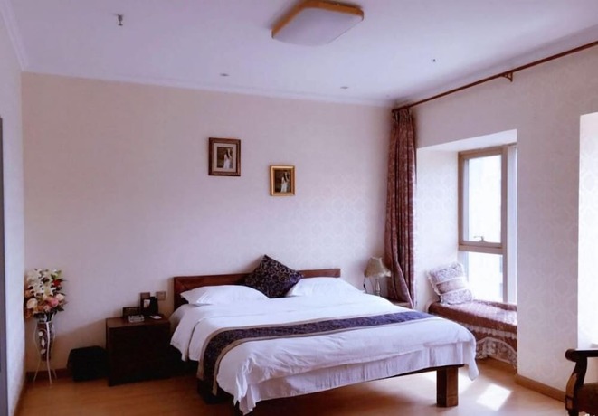 Imagen de la habitación del Hotel Harbin Rose Apartment. Foto 11