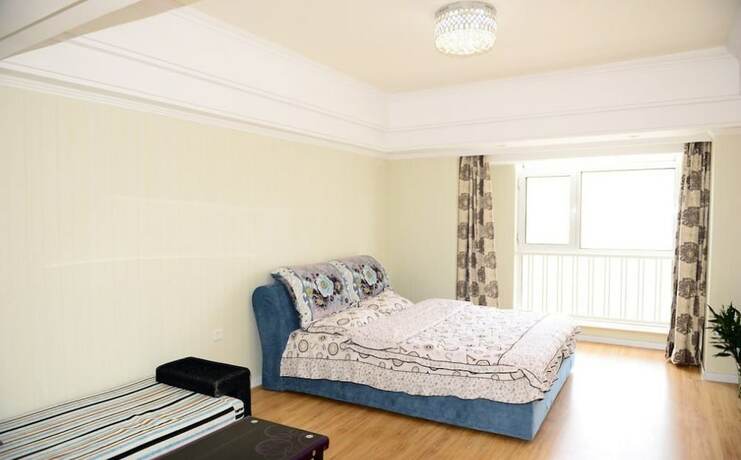 Imagen de la habitación del Hotel Harbin Rose Apartment. Foto 13