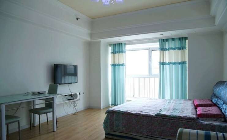 Imagen de la habitación del Hotel Harbin Rose Apartment. Foto 15