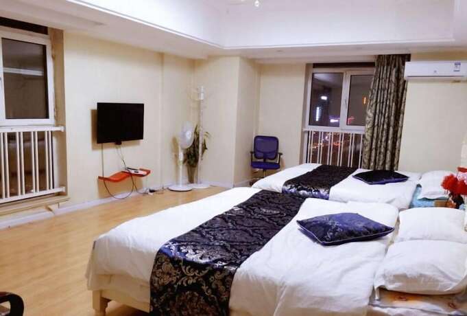 Imagen de la habitación del Hotel Harbin Rose Apartment. Foto 17