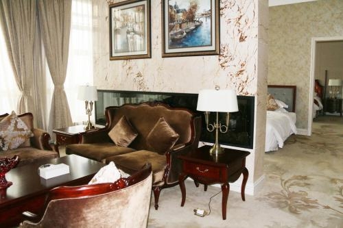 Imagen de la habitación del Hotel Harbin Sun Island Garden. Foto 8