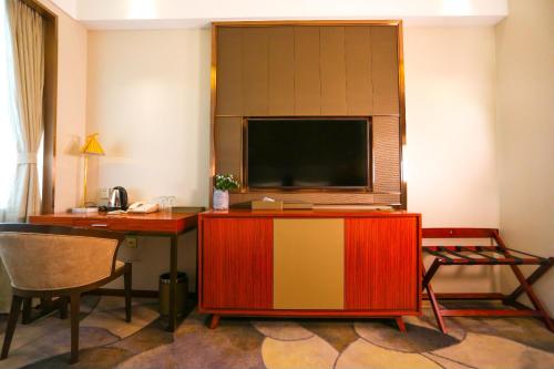 Imagen de la habitación del Hotel Harbin Sydcn. Foto 8