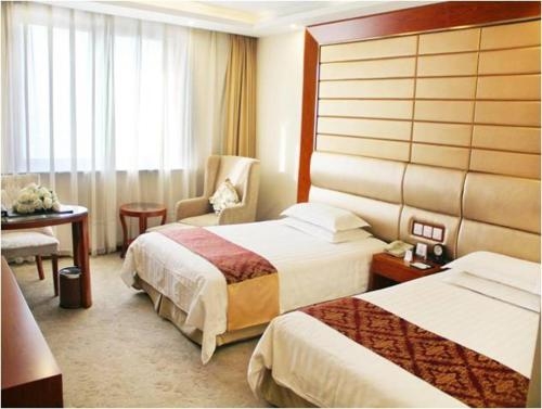 Imagen de la habitación del Hotel Harbin Victories. Foto 6