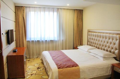 Imagen de la habitación del Hotel Harbin Victories. Foto 7