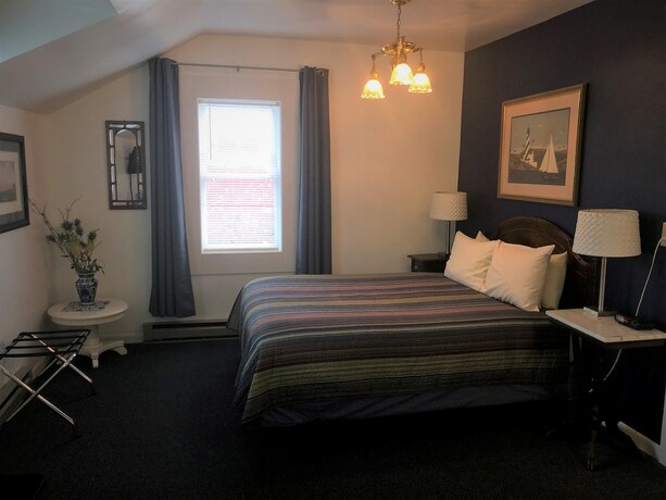 Imagen de la habitación del Hotel Harbor\'s Edge Motel. Foto 13