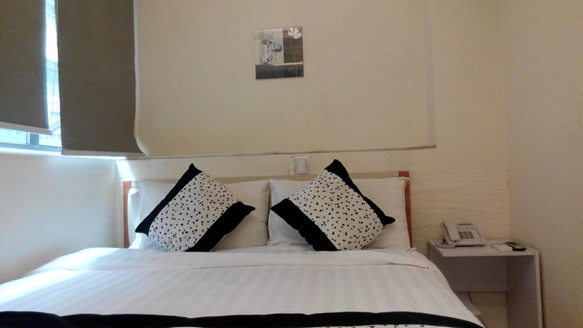 Imagen de la habitación del Hotel Harbour Inn, Kowloon. Foto 2