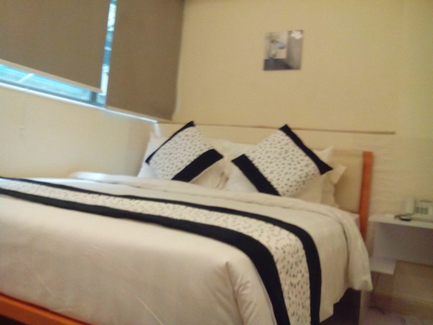 Imagen de la habitación del Hotel Harbour Inn, Kowloon. Foto 5
