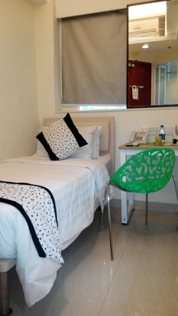 Imagen de la habitación del Hotel Harbour Inn, Kowloon. Foto 6