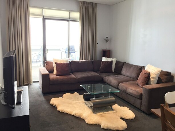 Imagen del bar/restaurante del Hotel Harbour Town Apartment. Foto 20