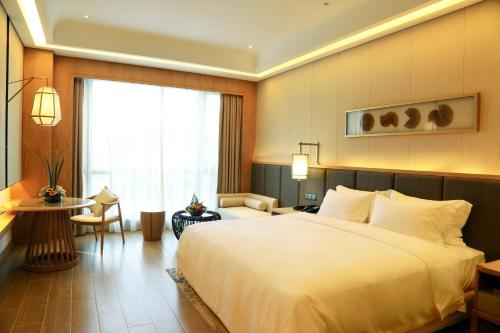 Imagen de la habitación del Hotel Harman Resort Sanya. Foto 13