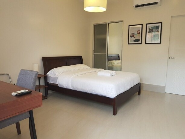 Imagen de la habitación del Hotel Harman Suites Moalboal. Foto 15