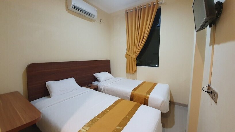 Imagen de la habitación del Hotel Harmony Inn Belitung. Foto 13
