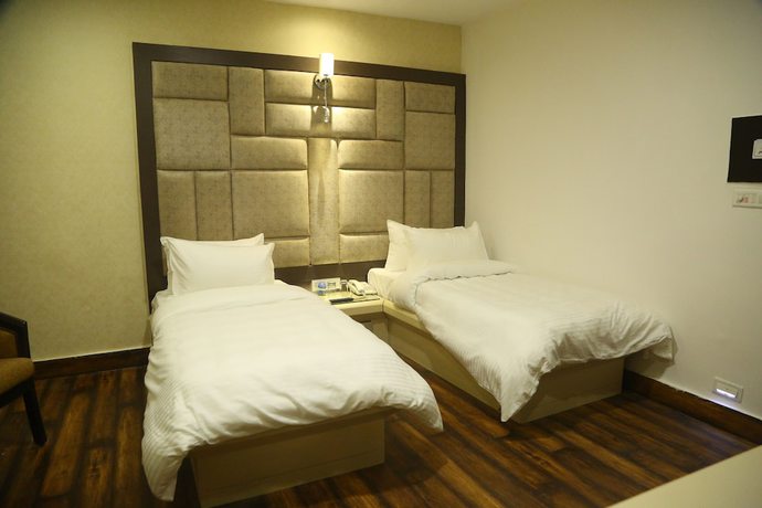 Imagen de la habitación del Hotel Harmony Inn, Meerut. Foto 11