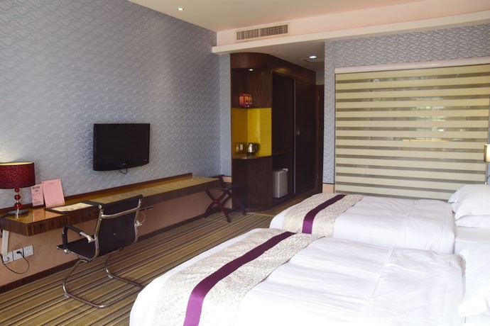 Imagen de la habitación del Hotel Harmony Resort, Zhuhai. Foto 8