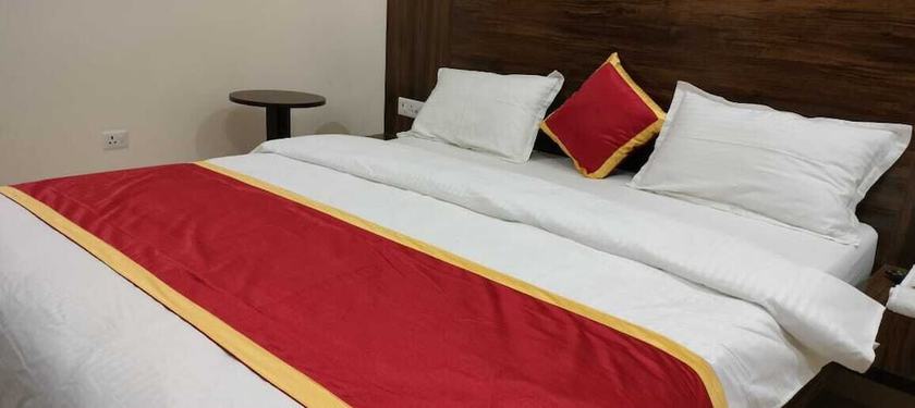 Imagen de la habitación del Hotel Harmony Rooms And Banquet. Foto 2