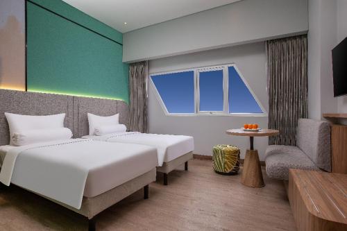 Imagen de la habitación del Hotel Harper Banjarmasin. Foto 5